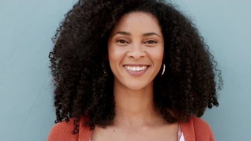 Smiling Woman with Curly Hair Portrait Close Up