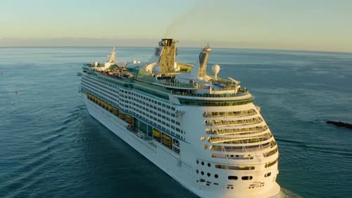 Aerial view of a beautiful white cruise liner in a sunny day.