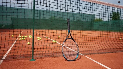 racket and net on tennis court sports equipment for playing training competition active lifestyle