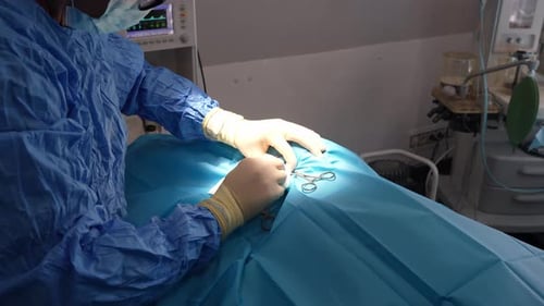 Surgeon Performing Operation in Operating Room