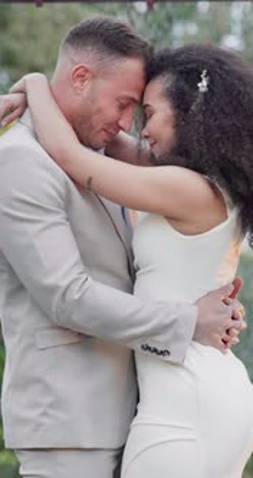 Newlyweds Embrace in a Tender Wedding Moment