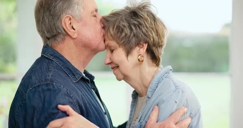 Senior Couple Embracing in Soft Home Light
