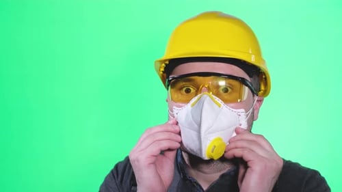 Man Wearing Safety Mask, Hard Hat, Safety Glasses