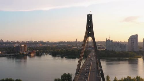 Urban Scape with River and Bridge with Car Traffic