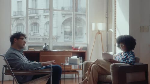 People Sitting in Chairs Talking