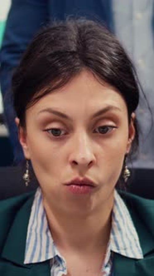 Displeased Irritated Team Leader Reading the Development Project on Laptop