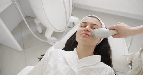 Woman Receiving Facial Treatment at a Clinic