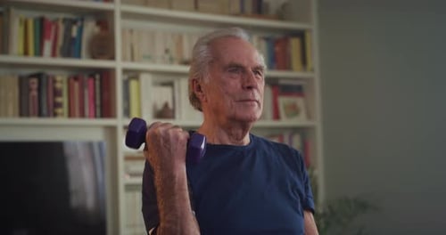 Senior Man Doing Bicep Curls at Home