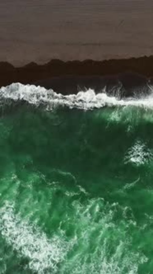 Aerial Top View of Beach with Black Sand