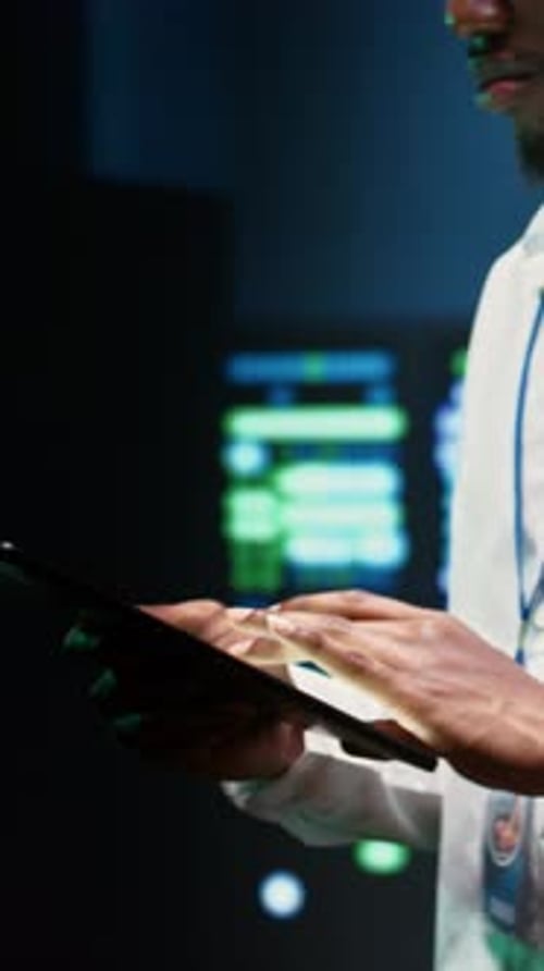 Young Adult Uses Tablet at Digital Workplace