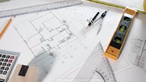 Top view of house plan blueprint paper with repair tools on table desk at architecture office