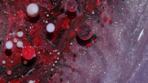 Bubbles of Colorful Paint Exploding and Mixing Together