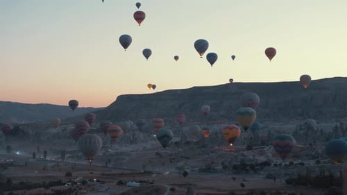Hot Air Balloons Floating Over Valley at Sunrise