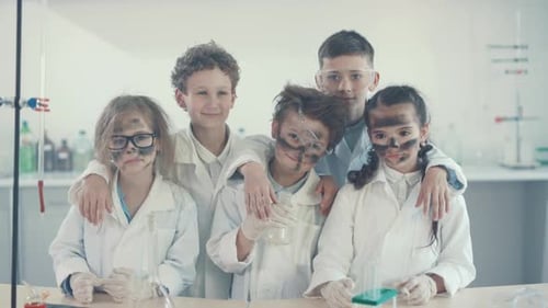 Children with Smudged Faces in a Science Lab