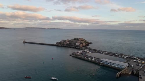 359
High reveal drone footage of St Peter Port harbour Guernsey Channel Islands from Castle Cornet