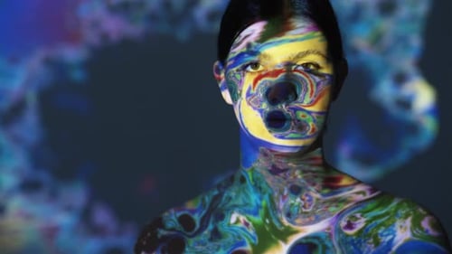 Woman's Face with Colorful Abstract Projection Art