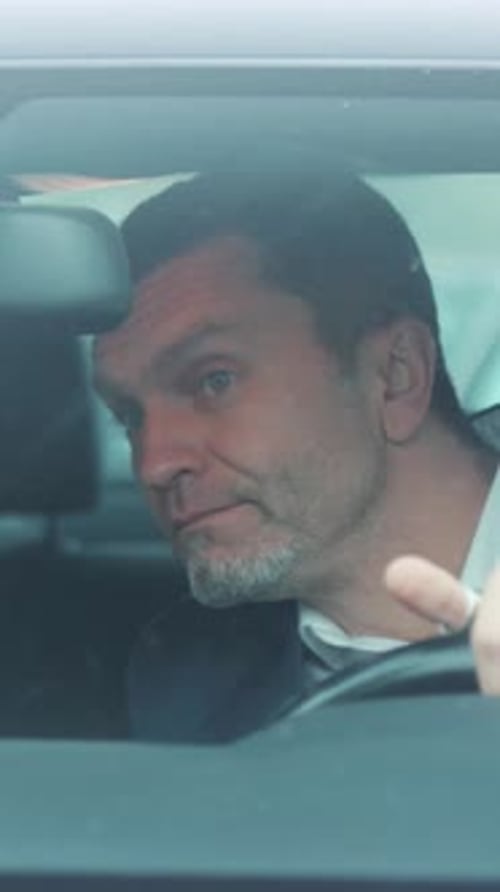 A Thoughtful Driver in an Urban Setting Reflecting Emotions and Experiences Behind the Wheel