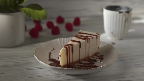 Delicious Cheesecake Slice with Chocolate Drizzle