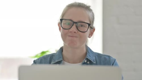 Close Up of Rejecting Young Woman in Denial While Using Laptop