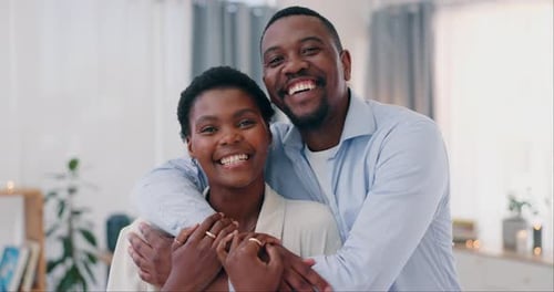 Happy Couple Smiling and Embracing Indoors