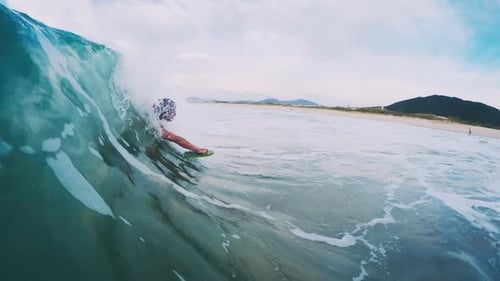 Woman surfer. Young woman walks barefoot with surf board and checks the waves and surfing conditions