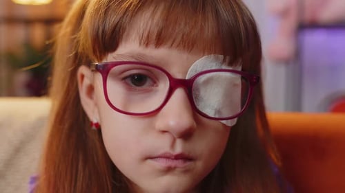 Girl With Eye Patch Wearing Glasses Close Up