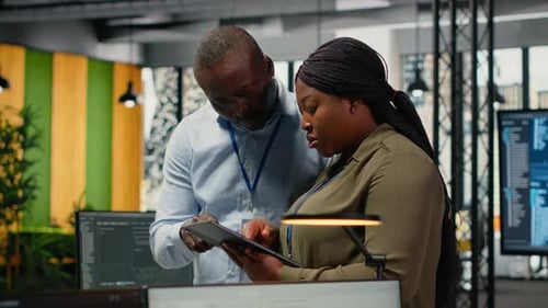 Team of Software Developers in Office Automating Workflows Using AI