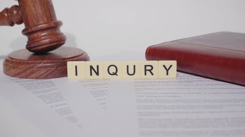 Gavel and Inquiry Letter Tiles on Document