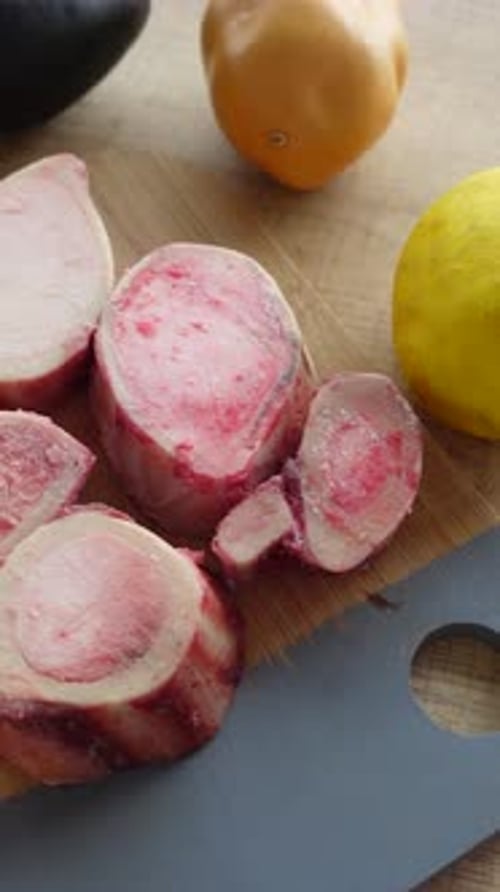 Various Pieces of Cut Bone on Cutting Board