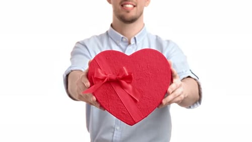 Man Giving Heart-Shaped Gift on White Background