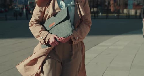 Happy Beautiful Young Business Woman in Formal Clothes Walking to Camera Along Sunny Square Slow
