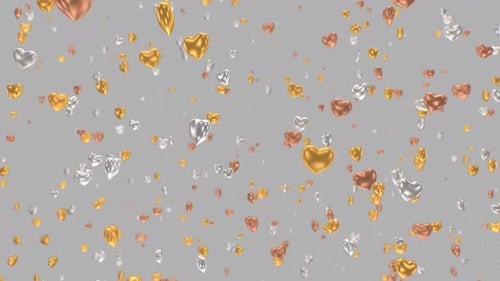 Shiny Gold Silver and Bronze Heart Ornaments Falling In Slow Motion - 4K