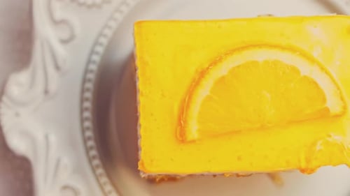 Waviness Effect of A Piece of Tangerine Cake with Jelly