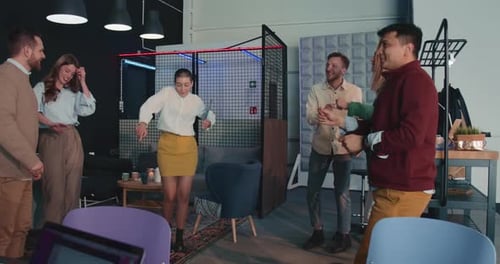 Group of Happy Fun Young Colleagues Business People Dance Together Relaxing at Office Celebration