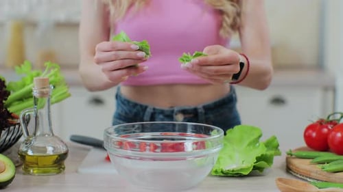 Close Up Woman Making Salad in Transparent Bowl Pinching Fresh Salat Healthy Eating and Cooking