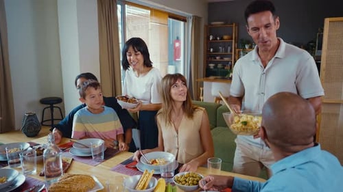 Family Sharing Meal Around Dining Table at Home