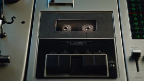 Close up of Cassette Player with Hand Starting