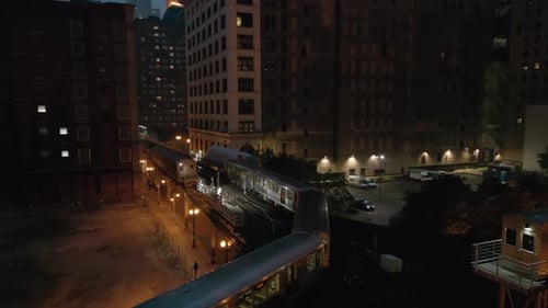 Train Passing on Elevated Track at Night Subway in Downtown Chicago