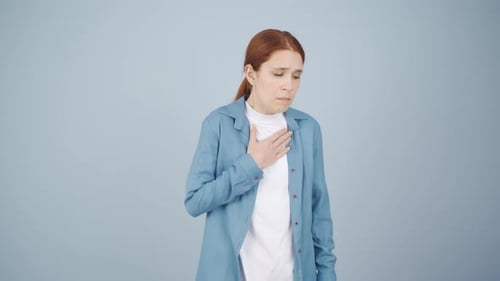 Sick Woman Coughing and Touching Chest