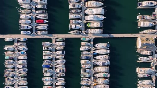 Aerial Top View of Marina Boats Yachts Docked in Calm Water Boat Harbor Marina Filled with Yachts
