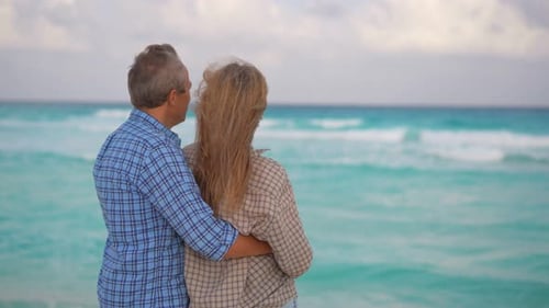 Romantic Middleaged Couple Enjoying a Peaceful Evening Together on the Beach Love Connection and