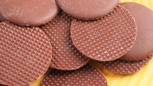 Chocolate candy wafers rotating close up shot