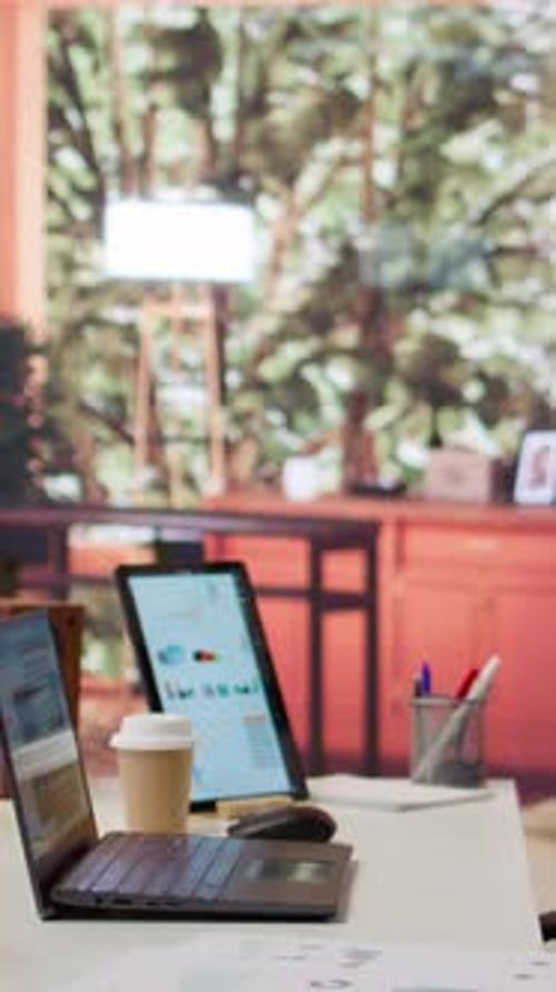 Vertical Video Empty Modern Home Workstation of an Entrepreneur with Laptop and Tablet