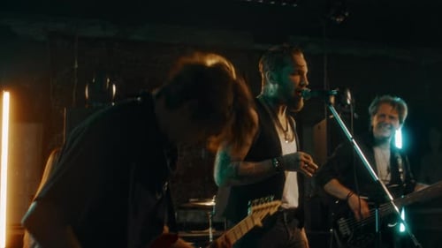 Rock Band Performing Live on Dark Stage