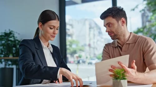 Two Business Managers Negotiating on Corporate Agreement Sitting Office Closeup