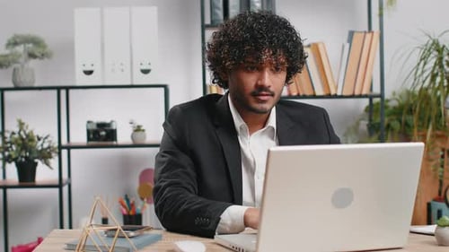 Indian Business Man Freelancer at Office Start Working on Laptop Computer Sends Online Messages