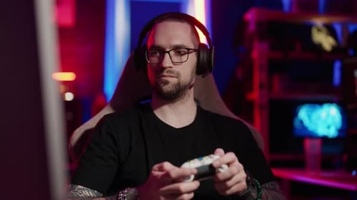 Man Gamer Playing Video Game with Controller