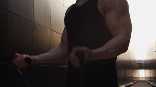 Man Works Out with Resistance Bands in Urban Setting