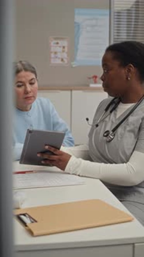Doctor and Patient Discussing Results in Office
