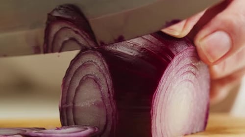 Slicing a Red Onion with a Knife